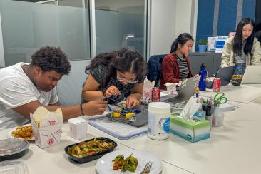 Jacob, Suhani, Alice, and Amy working at SPARK